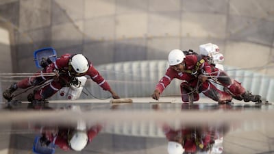 It takes three weeks to completely scrub down a building such as Reem Island’s Sky Tower . Christopher Pike / The National