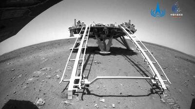 An image taken by the rear obstacle avoidance camera of China's Zhurong Mars rover showing the landing platform of the Tianwen-1 Mars probe, after the rover drove down the ramp onto the surface of Mars. AFP