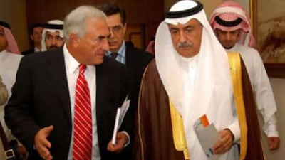 The director of the International Monetary Fund Dominique Strauss-Kahn, left, walks with the Saudi finance minister Ibrahim al-Assaf following a meeting of the Gulf Cooperation Council finance ministers in Jeddah today.