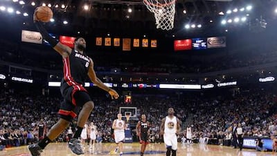 LeBron James dunks for Miami Heat against Golden State Warriors on his way to breaking the 20,000 points barrier.