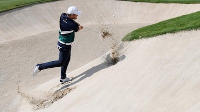 Tyrrell Hatton hits his third shot on the 18th hole during the second round of the DP World Tour Championship. Ross Kinnaird / Getty Images
