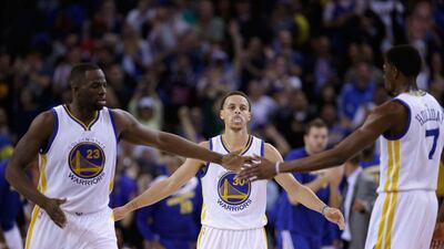 Stephen Curry, centre, and the Golden State Warriors have the best record in the NBA. Ezra Shaw / Getty Images / AFP / March 18, 2015