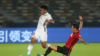 Romarinho of Al Jazira is tackled by Tomoaki Makino of Urawa Red Diamonds during the FIFA Club World Cup UAE 2017 match between Al Jazira and Urawa Red Diamonds at Zayed Sports City Stadium on December 9, 2017 in Abu Dhabi, United Arab Emirates. (Photo by Matthew Ashton - AMA/Getty Images)