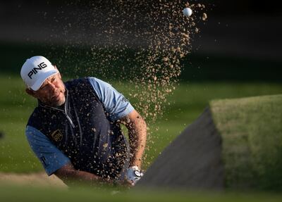 England's Lee Westwood, who won in Abu Dhabi last week, plays out of a bunker on the 10th hole as he finished the first round in Dubai 6-over par. AP