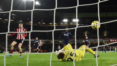 Sheffield United's Oliver McBurnie beats West Ham United goalkeeper David Martin to score. AFP