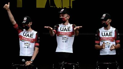 Tadej Pogacar, centre, and UAE Team Emirates teammates attend the team's presentation two days ahead of the 108th edition of the Tour de France. AFP