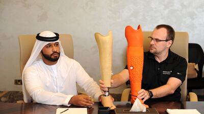 Fahad Ali, a long-term amputee, compares conventional prosthetics with his new 3D printed prosthetics with Sebastian Giede, a certified orthopaedic prosthetist with Mediclinic. Dubai Health Authority