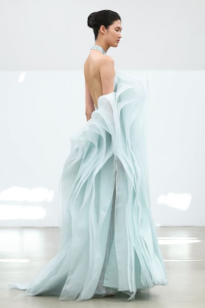 Al Ali presented a muted palette with shades of powder blue, dove grey, crepe pink and muted gold. AFP