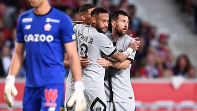 Neymar, centre, and Lionel Messi of PSG. Getty Images