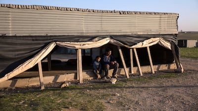 Salah El Dabashas,15, sits with his five-year-old cousin, Omar, at a gathering point in the unrecognised village of Al Poraa, near the city of Arad, in the Negev desert on February 2, 2018. Heidi Levine
