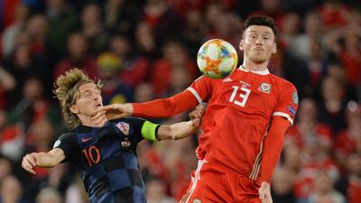 epa07918975 Wales Kieffer Moore (R) in action against Croatia's Luka Modric (L) during the UEFA EURO 2020 group E qualifier soccer match between Wales and Croatia held at Cardiff City Stadium in Wales, Britain, 13 October 2019. EPA/PETER POWELL