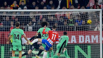 Girona's Valery Fernandez scores their first goal against Atletico. AFP