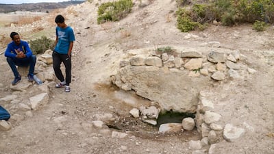 Villagers sit next to a dried-out spring in Oued Zarga Beja in the Tunisian north-west
