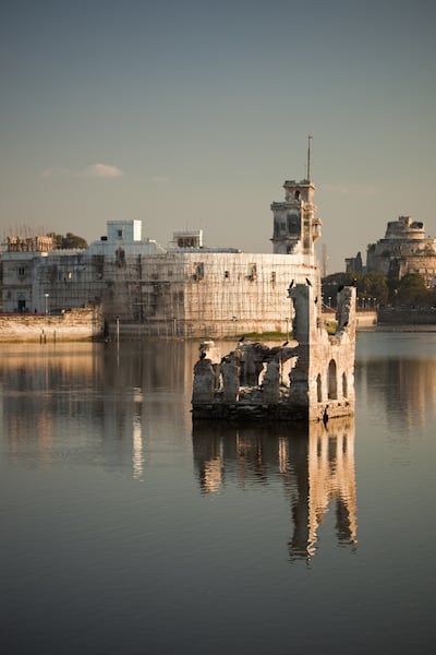 Crumbling forts and former majestic homes surround Jamnagar Lake. Getty Images