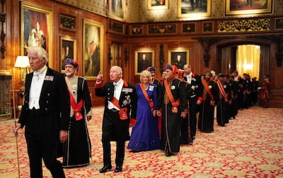 Oman's Sultan Haitham and Britain's King Charles walk in a procession to the state banquet. Reuters