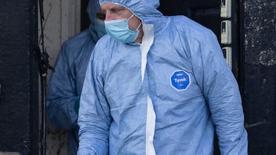 Police forensic officers search a house in Rochdale, England. Getty Images