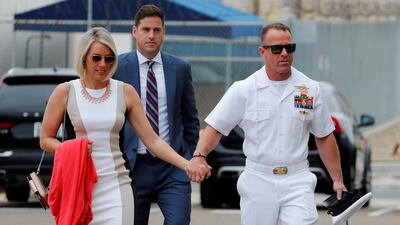 US Navy SEAL Special Operations Chief Edward Gallagher arrives at court with his wife and brother Sean for his war crimes trial in San Diego, California, June 18, 2019. Reuters