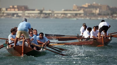 The RAK Free Trade Zone team, right in white, compete against the Al Shaheen Adventure Training team, left in blue, during the autumn rowing regatta on December 11, 2010. Amy Leang / The National
