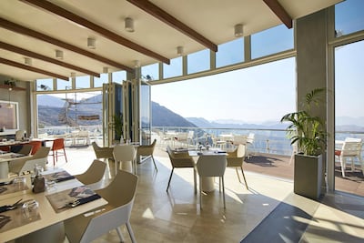 The interiors feature a floor-to-ceiling windows to offer guests uninterrupted views of the Hajjar Mountains