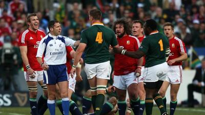 Bakkies Botha of South Africa and Tom Croft of the Lions have words as referee Christopher Berdos steps in during a Test in 2009. David Rogers / Getty Images