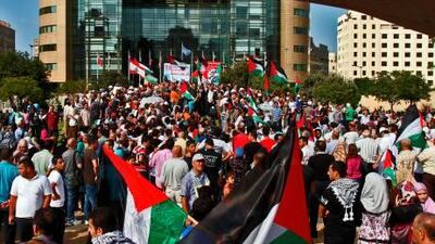 More than 2,000 demonstrators hold up Palestinian flags as they gathered outside the United Nations' offices in Beirut yesterday in a show of support for the Palestinian bid to secure full UN membership.