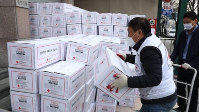 South Korean Red Cross workers prepare emergency relief kits packed with basic necessities for delivery to impoverished people experiencing difficulties amid the spread of coronavirus. Getty Images