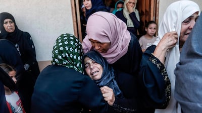Relatives of Karim Abu Fatayer, a 30-year-old member of the Islamist movement Hamas' military wing Al-Qassam Brigades who was shot the day before while demonstrating near the border with Israel, mourn during his funeral. AFP