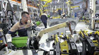 A Maserati assembly staff worker at the Maserati car plant. Giorgio Perottino / Reuters