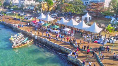 A drone image shows volunteers preparing to handle leaked oil from the bulk carrier ship MV Wakashio. Reuters