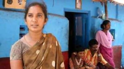 Nagarani, with her husband and two children in the background, at their home in Pulianthope slum in Chennai. Their bid for a DNA test to confirm whether a boy adopted by a Dutch family is their son kidnapped 11 years ago was turned down.