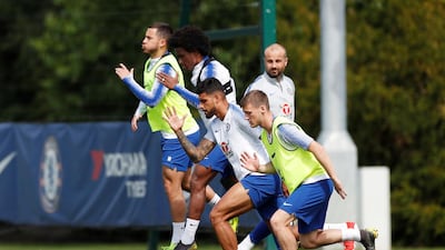 Chelsea's Emerson Palmieri, Eden Hazard and Willian with teammates during training. Reuters