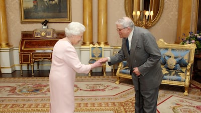 Britain's Queen Elizabeth II presents Mr Hockney with the Order of Merit at Buckingham Palace in London in 2012. AFP