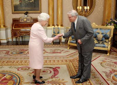 Queen Elizabeth II presents David Hockney with the Order of Merit at Buckingham Palace in May 2012. AFP