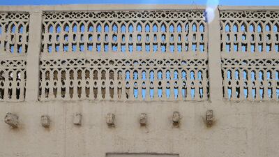 Beautiful Arabian designs can be seen on the rooftop boundary walls of residential buildings in Bur Dubai. Pawan Singh / The National