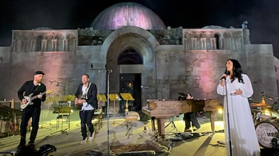 Coldplay perform with vocalist Norah Shaqur, right, at the Citadel.