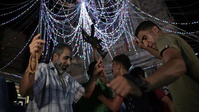 Relatives of the groom, dance in a party celebrating his wedding.