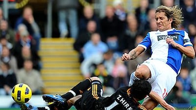 Blackburn's Michel Salgado goes in hard on Yury Zhirkov, Chelsea's Russian midfielder, during a game at Ewood Park in October.