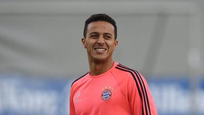 Bayern Munich’s Spanish midfielder Thiago Alcantara laughs during the final team training session one day prior to the Champions League semi-final, second-leg football match between Bayern Munich and Atletico Madrid at the club trainings area in Munich, southern Germany, on May 2, 2016. AFP / CHRISTOF STACHE