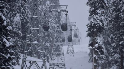 Cable car cabins pictured in January 2022 at Gulmarg, a scene that contrasts with this season's lack of snow. Reuters