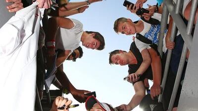 Eugenie Bouchard of Canada signs autographs for supporters in the crowd as she leaves the court after winning her first-round match against Aleksandra Krunic of Serbia at the 2016 Australian Open at Melbourne Park on January 18, 2016 in Melbourne, Australia. Scott Barbour/Getty Images