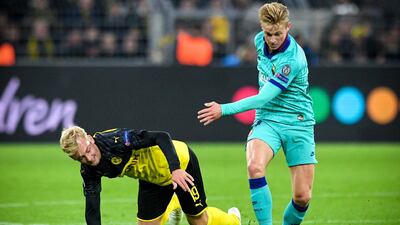 Dortmund's Julian Brandt in action against Barcelona's Frenkie de Jong. EPA