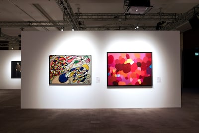 Work by Fahrelnissa Zeid, left, and Samia Halaby, right, on display in 2013. Victor Besa / The National
