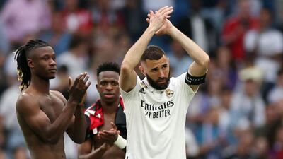 Real Madrid's French forward Karim Benzema applauds fans at the Bernabeu after it was earlier announced he would be leaving the club after 14 years. EPA
