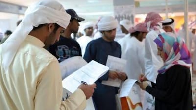 Emirati students hope to find their careers in the private and public sectors at a career fair in Dubai Men's College. Paulo Vecina / The National