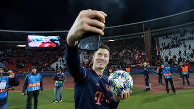 Bayern Munich's Robert Lewandowski celebrates with the match ball after scoring four against Red Star Belgrade in the Champions League on November 26. Reuters