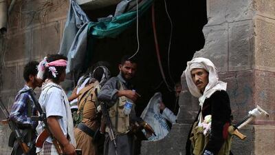 Yemenis look at the damage after Houthi rebels fired Katyusha rockets at a busy market in the eastern city of Marib on September 11, 2015. Abdullah Hassan/AFP Photo