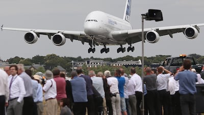 An Airbus A380 comes into land after putting on a performance for the crowds at Farnborough Airshow in 2014.