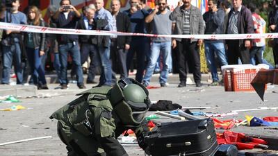 A bomb-disposal expert inspects a suitcase at the site of twin explosions near the main train station in Turkey's capital Ankara on October 10, 2015, where at least 97 people were killed. Aem Altan/AFP Photo