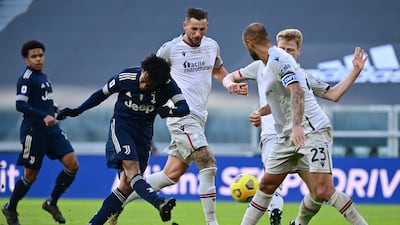 Juventus midfielder Juan Cuadrado shoots on goal. AFP