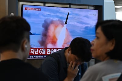 News coverage showing file footage after North Korea fired ballistic missiles towards the East Sea in protest against planned US-South Korea military drills. AFP
